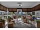 Relaxing sunroom with wicker furniture and access to the backyard at 1339 Villa Ln # 50, Apopka, FL 32712