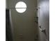 Bathroom with shower, round window and tile at 13653 Daniels Landing Cir, Winter Garden, FL 34787