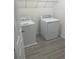 Laundry room with washer and dryer, and overhead shelving at 1409 Sawgrass Hammock Ln, Davenport, FL 33837