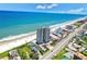 Aerial view showing beachfront building, parking and ocean at 1420 N Atlantic Ave # 1501, Daytona Beach, FL 32118