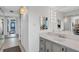 Bathroom with a vanity and large mirror at 1420 N Atlantic Ave # 1501, Daytona Beach, FL 32118