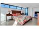 Bright bedroom with floral bedding and ocean view at 1420 N Atlantic Ave # 1501, Daytona Beach, FL 32118
