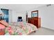Bright bedroom with a floral comforter and ocean view at 1420 N Atlantic Ave # 1501, Daytona Beach, FL 32118