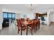 Bright dining room with wooden table and chairs, offering an ocean view at 1420 N Atlantic Ave # 1501, Daytona Beach, FL 32118