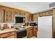 Kitchen with wood cabinets and breakfast bar at 1420 N Atlantic Ave # 1501, Daytona Beach, FL 32118