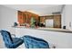 Breakfast bar with two blue chairs at 1420 N Atlantic Ave # 1501, Daytona Beach, FL 32118