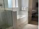 Elegant bathroom with soaking tub and walk-in shower at 14501 Grove Resort Ave # 3135, Winter Garden, FL 34787