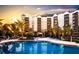 Resort-style pool and sundeck area with luxurious amenities at 14501 Grove Resort Ave # 3135, Winter Garden, FL 34787