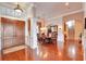 Formal dining room with hardwood floors, chandelier, and adjacent staircase at 1500 Langham Ter, Lake Mary, FL 32746