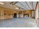 Garage with pegboard, shelves, and epoxy flooring at 1500 Langham Ter, Lake Mary, FL 32746