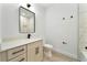 Modern bathroom with white quartz countertop and black accents at 1608 Airmont Ave, Deltona, FL 32725