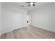 Simple bedroom with ample closet space and wood flooring at 1608 Airmont Ave, Deltona, FL 32725