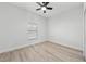 Bright bedroom featuring wood flooring and window blinds at 1608 Airmont Ave, Deltona, FL 32725