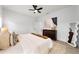 Well-lit bedroom with a dresser and a comfortable bed at 1608 Airmont Ave, Deltona, FL 32725