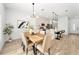 Bright dining area with wood table and neutral decor at 1608 Airmont Ave, Deltona, FL 32725