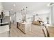 Open concept kitchen with island and stainless steel appliances at 1608 Airmont Ave, Deltona, FL 32725