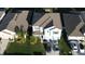 Charming home with manicured lawn, lush landscaping, and a private driveway perfect for parking multiple vehicles at 1706 Chatsworth Cir, Saint Cloud, FL 34771