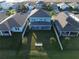 View of backyard featuring lush green grass, white fencing, and a covered patio at 1706 Chatsworth Cir, Saint Cloud, FL 34771