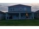 Two-story house with covered patio and fenced backyard at 1706 Chatsworth Cir, Saint Cloud, FL 34771