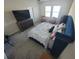 Main bedroom with large bed and TV at 1706 Chatsworth Cir, Saint Cloud, FL 34771