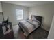 Bright bedroom with a double bed and window at 1706 Chatsworth Cir, Saint Cloud, FL 34771