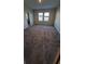 Spacious bedroom with two windows at 1706 Chatsworth Cir, Saint Cloud, FL 34771