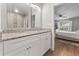 Double vanity bathroom with a view into a bedroom and walk-in shower at 1780 Sw 168Th Loop, Ocala, FL 34473
