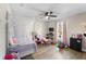 bedroom with a canopy bed, toys, and ample natural light at 1780 Sw 168Th Loop, Ocala, FL 34473