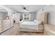 Bright bedroom with a large bed, dresser, and window view at 1780 Sw 168Th Loop, Ocala, FL 34473