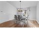 Dining room with hardwood floors, chandelier, and a view to entryway at 1780 Sw 168Th Loop, Ocala, FL 34473