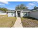 House exterior featuring a walkway, landscaping, and a gray color scheme at 1780 Sw 168Th Loop, Ocala, FL 34473