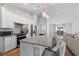 Open concept kitchen with island and stainless steel appliances at 1780 Sw 168Th Loop, Ocala, FL 34473
