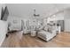 Open living room with a large sectional sofa and view into the kitchen at 1780 Sw 168Th Loop, Ocala, FL 34473