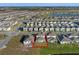 Aerial view of house and community pool at 1914 Summer Serenity Dr, Kissimmee, FL 34744