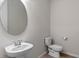 Small powder room with pedestal sink and toilet at 1914 Summer Serenity Dr, Kissimmee, FL 34744