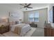 Bright bedroom with large window and ceiling fan at 1914 Summer Serenity Dr, Kissimmee, FL 34744