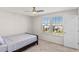 Bright bedroom with a double bed, carpet flooring, and two windows at 1914 Summer Serenity Dr, Kissimmee, FL 34744