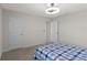 Comfortable bedroom with a double bed, carpet flooring, and ceiling fan at 1914 Summer Serenity Dr, Kissimmee, FL 34744