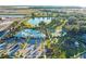 Aerial view of community pool, tennis courts, and playground at 1914 Summer Serenity Dr, Kissimmee, FL 34744