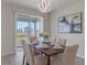 Elegant dining room with a view of the backyard at 1914 Summer Serenity Dr, Kissimmee, FL 34744