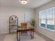 Bright home office features hardwood floors and a modern desk setup at 1914 Summer Serenity Dr, Kissimmee, FL 34744