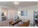 Spacious home office with hardwood floors, natural light, and stylish furnishings at 1914 Summer Serenity Dr, Kissimmee, FL 34744