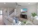 Spacious living room with comfortable seating and large TV at 1914 Summer Serenity Dr, Kissimmee, FL 34744