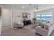 Relaxing living room overlooking a lake at 1914 Summer Serenity Dr, Kissimmee, FL 34744