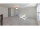Spacious loft area with carpeted floor and chandelier at 1914 Summer Serenity Dr, Kissimmee, FL 34744