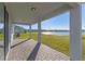 Covered patio overlooking a lake, perfect for outdoor relaxation at 1914 Summer Serenity Dr, Kissimmee, FL 34744