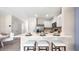 Kitchen island with seating and quartz countertop at 1968 Tamarack Pass, Davenport, FL 33837