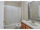 Clean bathroom with a shower/tub combo, toilet and vanity at 216 Blue Crystal Dr, Deland, FL 32720