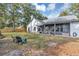 Large backyard with screened patio and grassy area at 2376 Park Village Pl, Apopka, FL 32712