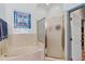 Bathroom with a soaking tub and a walk-in shower at 2376 Park Village Pl, Apopka, FL 32712